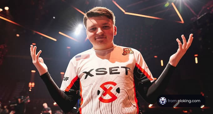 Esports player in white jersey celebrating at event