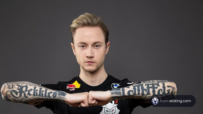 Young man posing with arms crossed showing elaborate tattoo designs