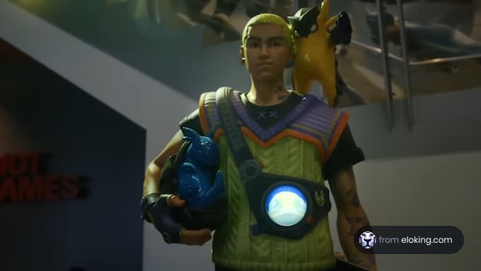 A collectible action figure of a gamer character holding colorful creatures.