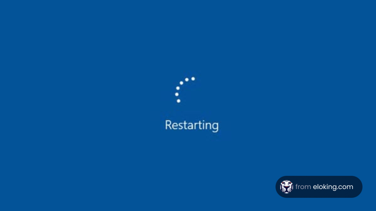 Blue screen displaying 'Restarting' with a loading icon
