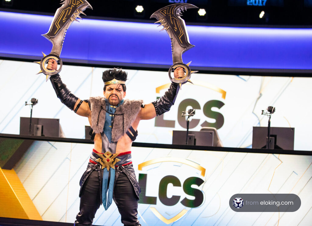 Cosplayer in warrior costume holding two axes at LCS 2017 event