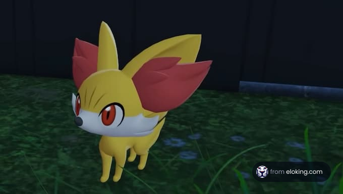 Un lindo Fennekin de pie en la hierba