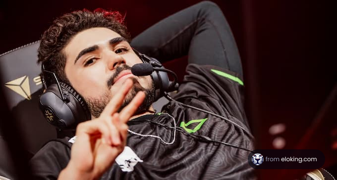 Esports player making a peace sign while wearing a gaming headset