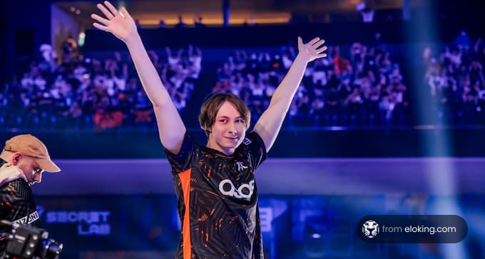 Esports player celebrating a victory in an arena