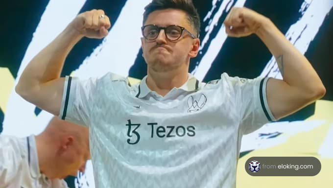 A proud esports player celebrating in a Tezos jersey