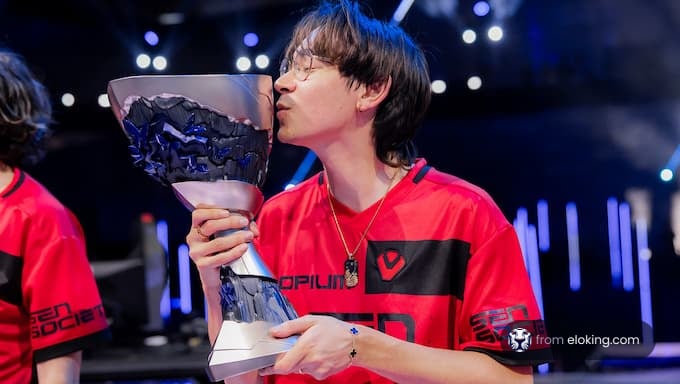 Esports player kissing a trophy at a gaming event