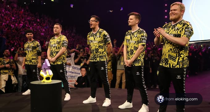 Esports team celebrating victory on stage at a gaming event