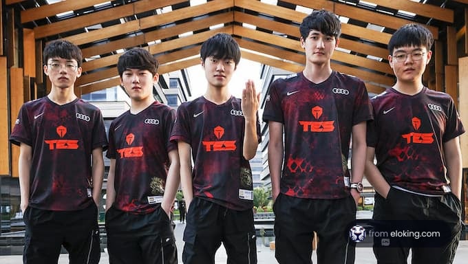 A group photo of an esports team wearing matching jerseys.