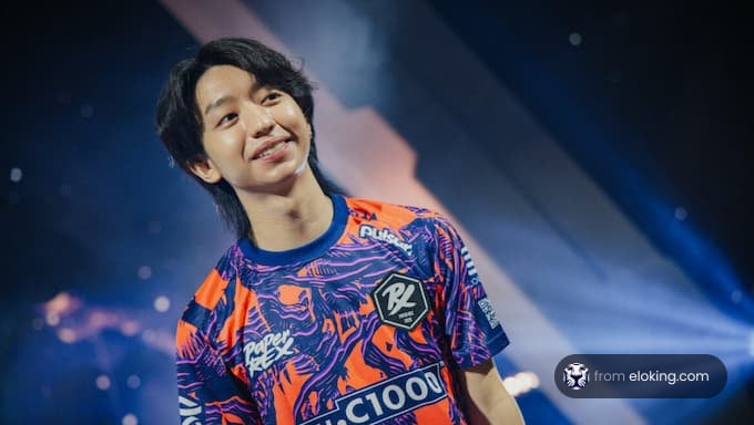 An esports player smiling on stage