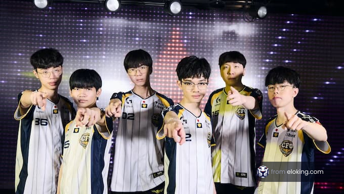 A group of six esports players pointing at the camera