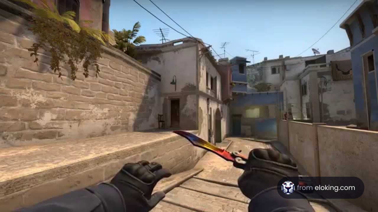 First person view of a player holding a knife in a game with Mediterranean style buildings