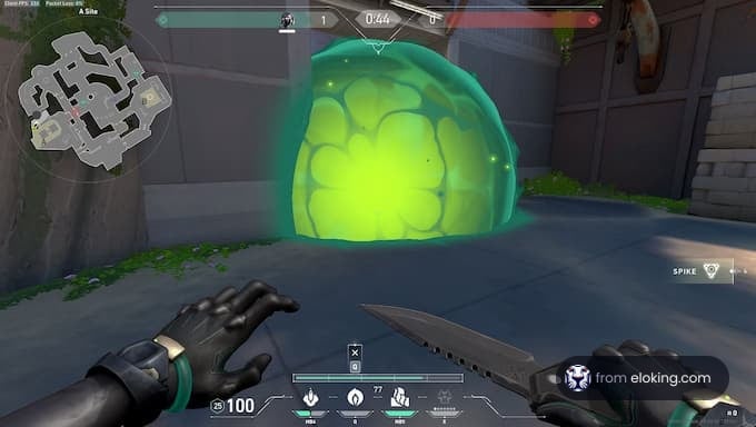 First-person view in a video game showing hands holding a knife with a glowing green barrier in the background