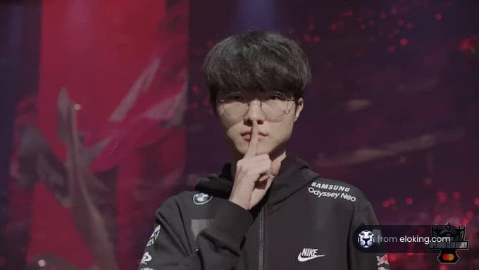 Gamer making a shushing gesture on an esports stage