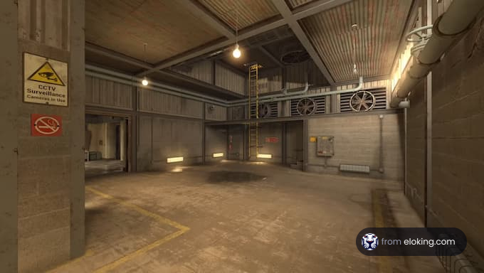 A spacious industrial room with CCTV surveillance and ceiling fans.