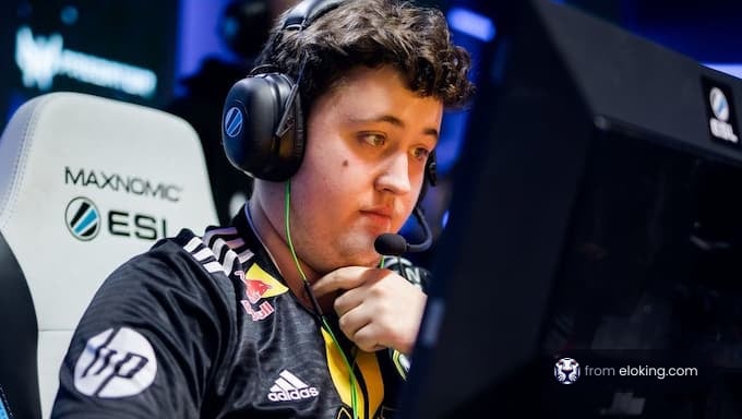 An esports player focused on the game during a tournament.