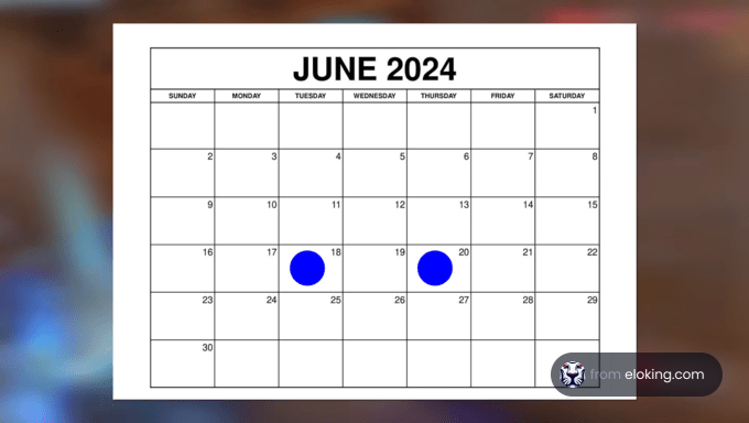 June 2024 calendar with two blue dots marking special dates