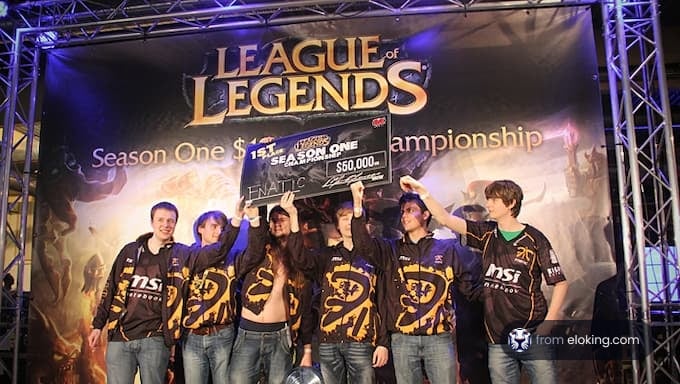 Winning team holding trophy at League of Legends Season One Championship