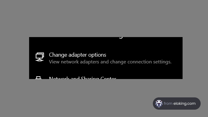 Windows network settings interface with options to change adapter and view network and sharing center