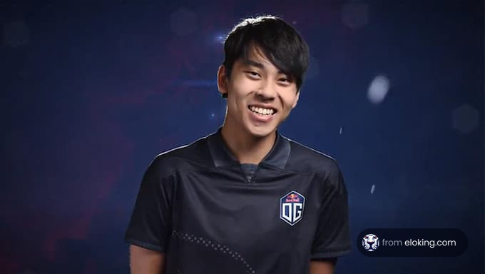 Smiling esports player in a black jersey