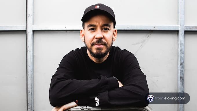 Portrait of a man wearing a black sweater and cap