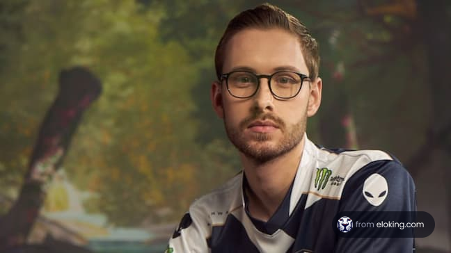 Professional gamer in jersey posing with glasses
