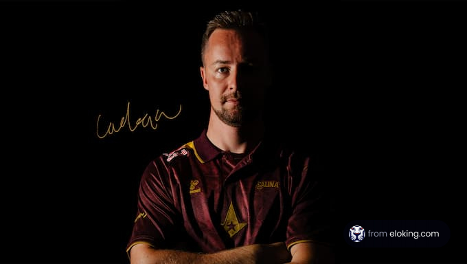 Portrait of a professional sportsman in a dark setting.