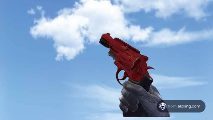 Red flare gun held against a clear blue sky with clouds