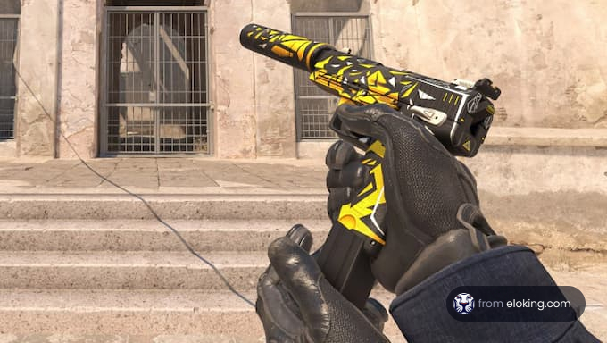 A stylish yellow handgun being held with gloves.