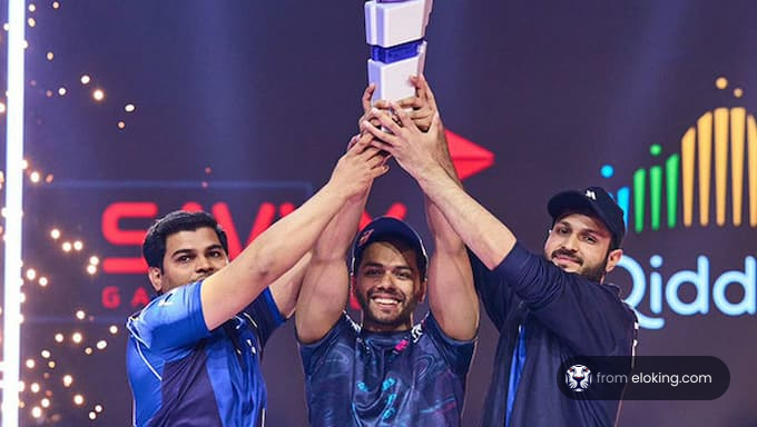 Three teammates celebrating with a trophy at a gaming event