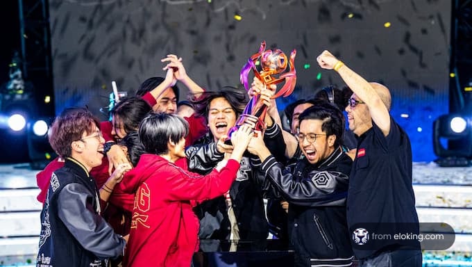 Team celebrating their victory with a trophy at an esports championship