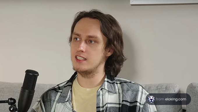 Young man with microphone in a casual home setting